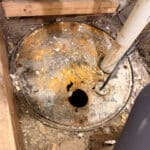 Lid to sump pump is rotted out. in Denver