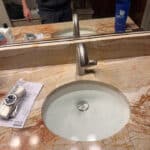 Replace two master bath lav faucets with owner provided ones in Denver