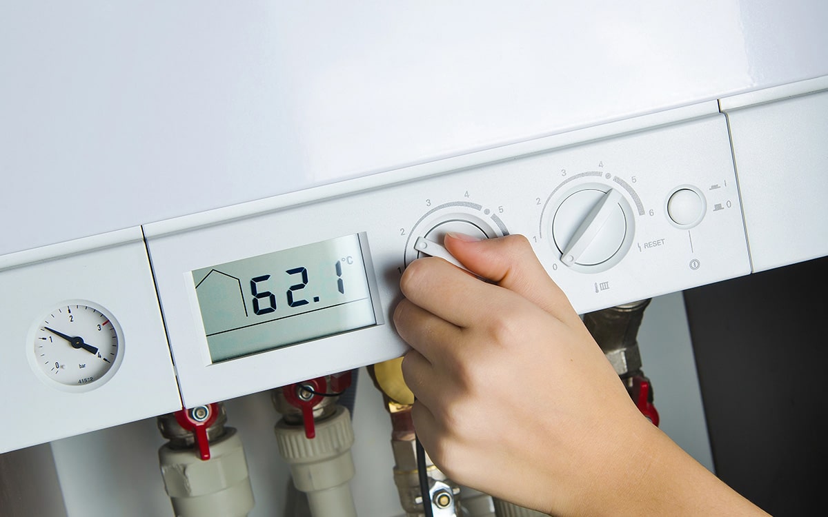 Thermostat settings being checked after a storm when the boiler won’t ignite.