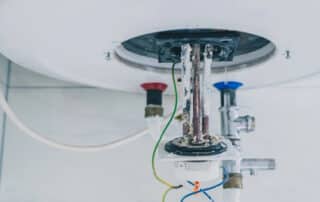 Cardom Plumbing & Heating shows Cleaning and Descaling Your Water Heater by removing limescale and thermostat from an electric water heater.