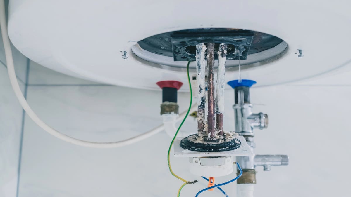 Cardom Plumbing & Heating shows Cleaning and Descaling Your Water Heater by removing limescale and thermostat from an electric water heater.