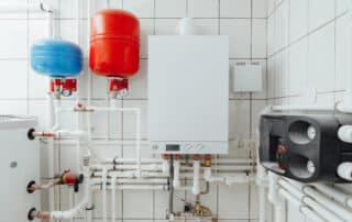 Modern boiler system with pipes and tanks.