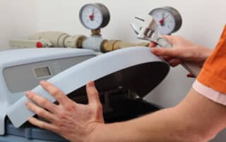 Wondering Is it Best to Repair or Replace a Water Softener? This technician from Cardom Plumbing & Heating shows repair in action during a service call.