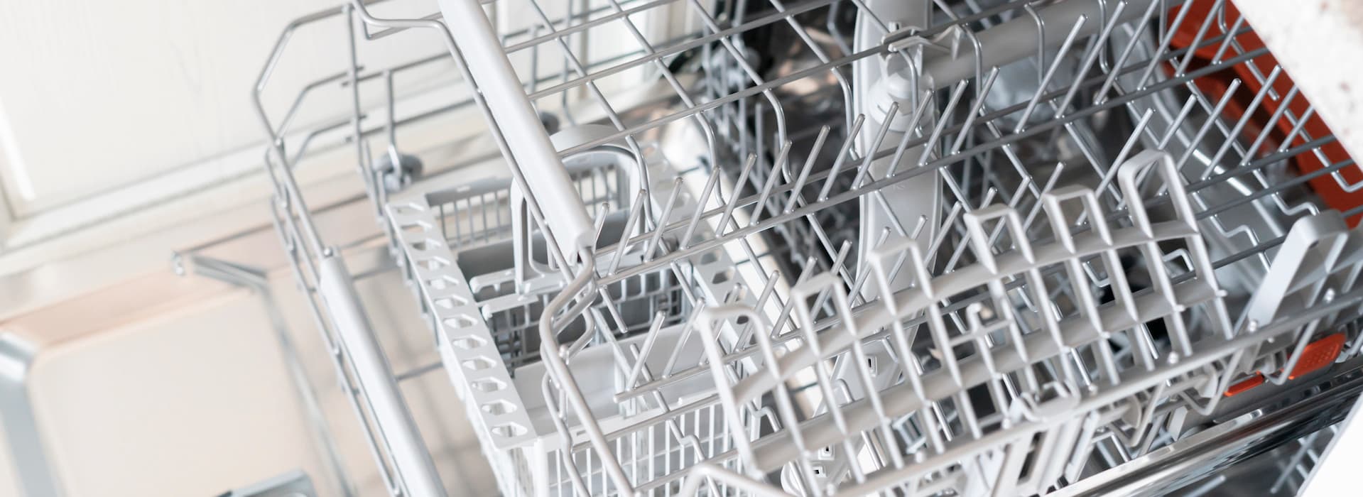 Empty open dishwasher rack